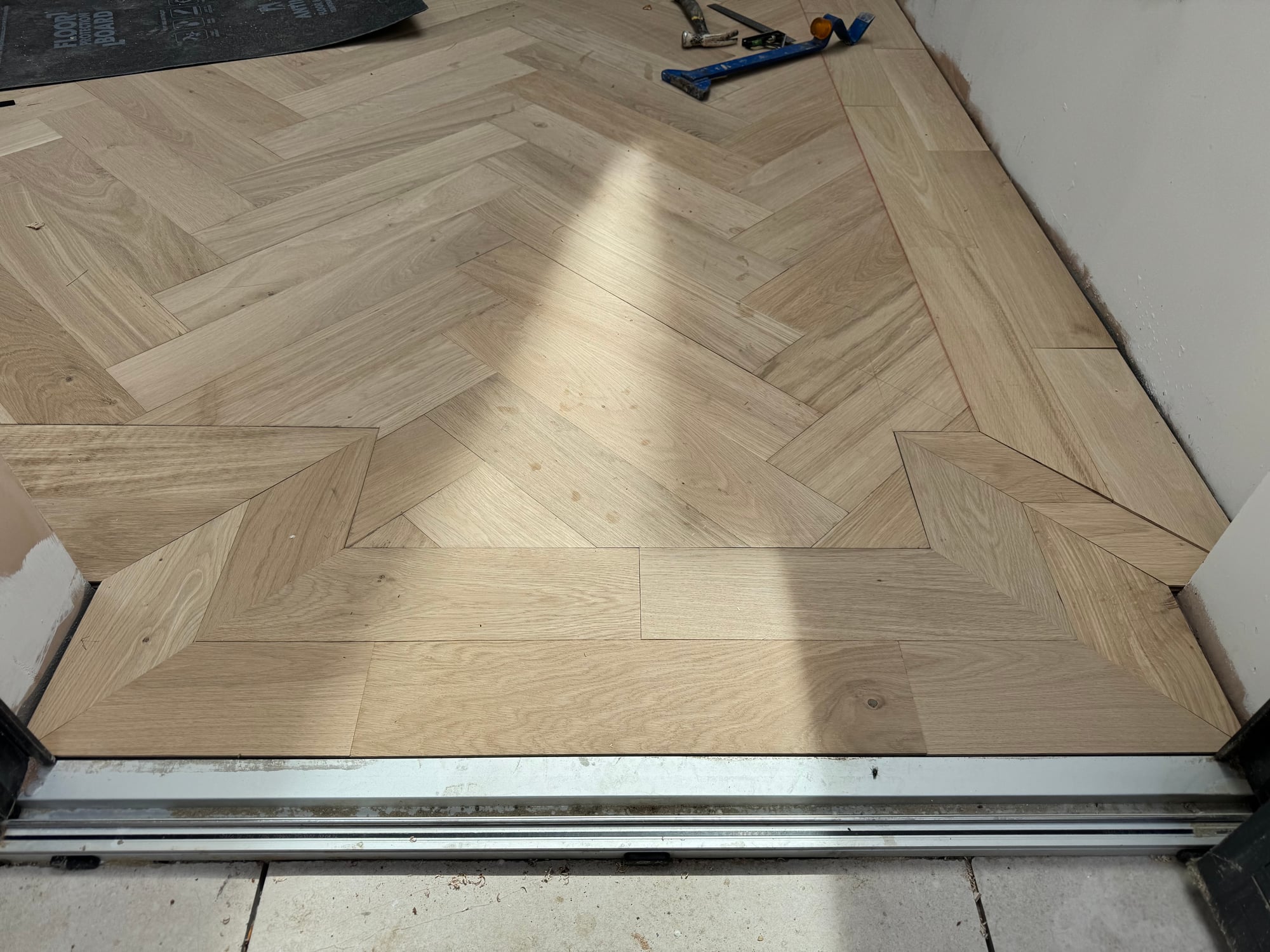 Herringbone parquet doorway transition