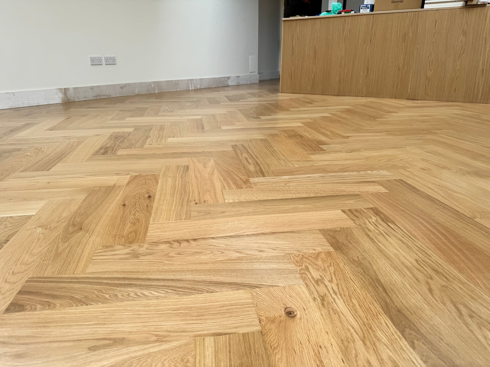 Herringbone parquet under skylights