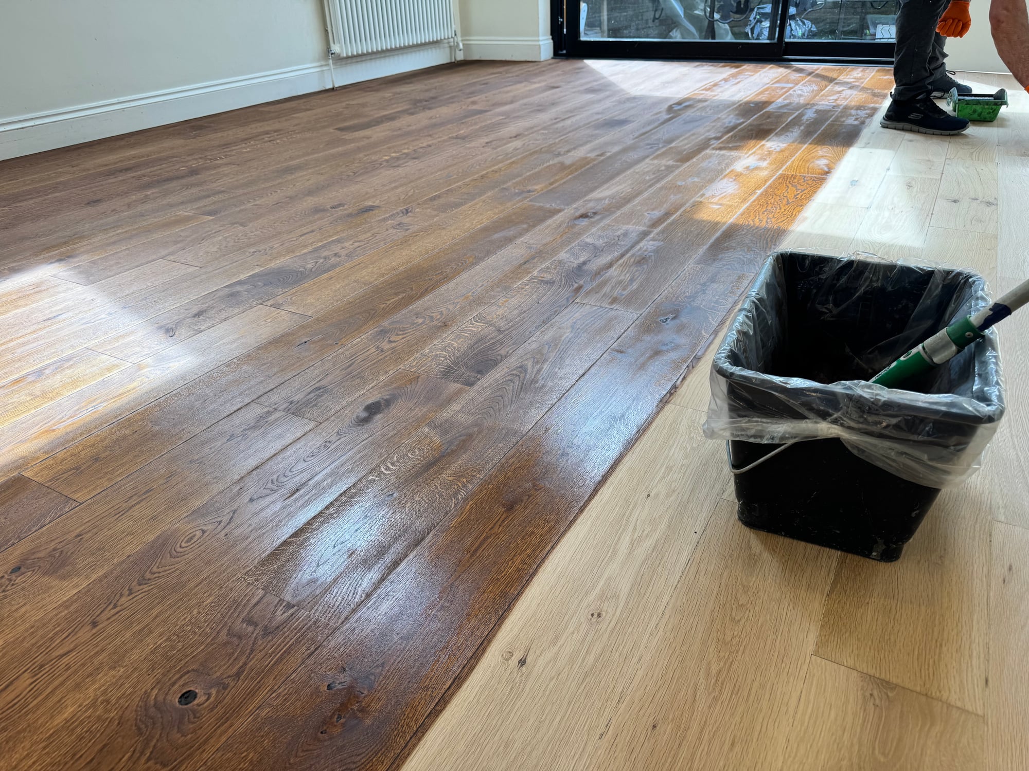 Oak boards mid-finish during staining