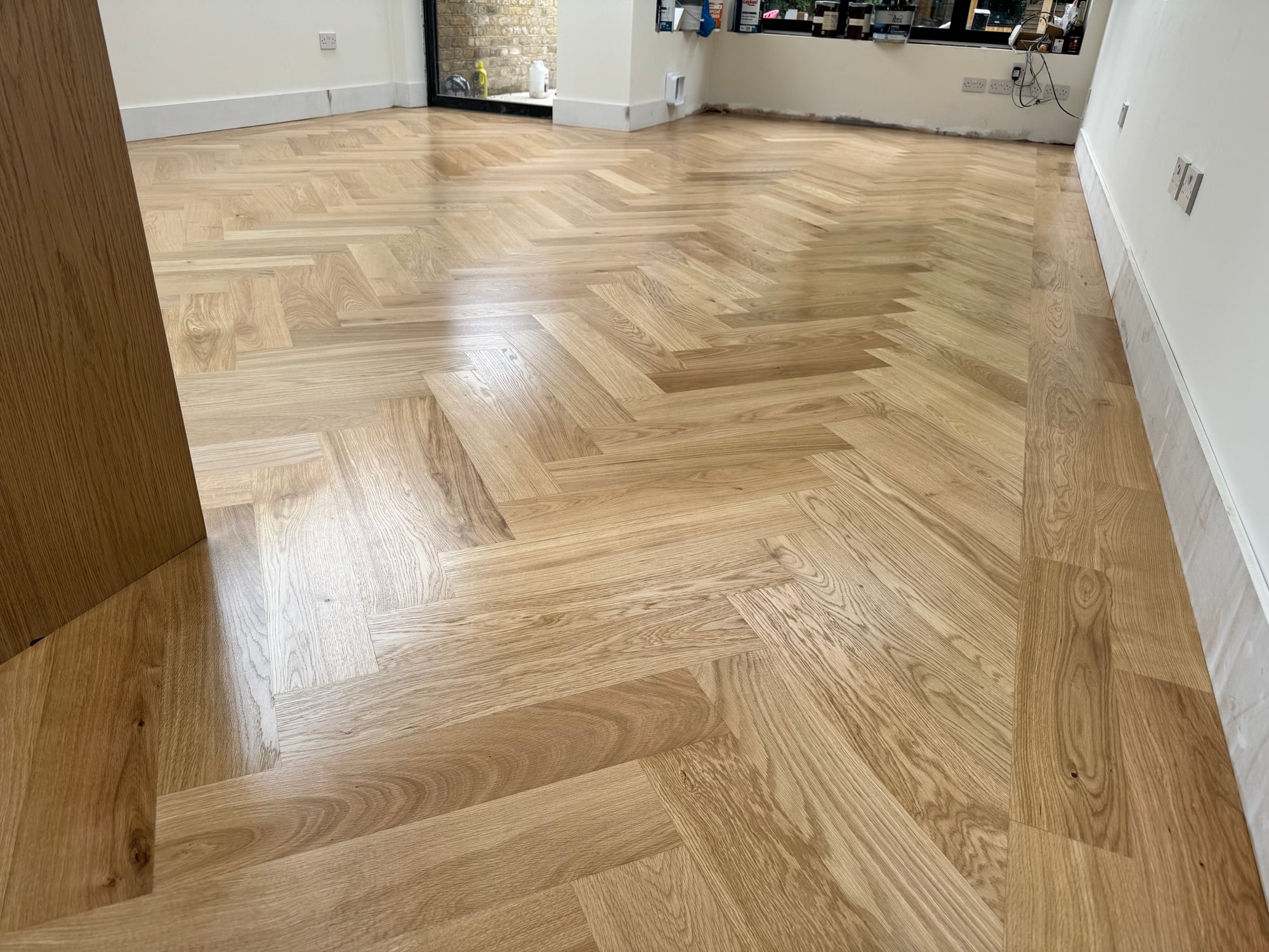 Restored light oak herringbone parquet