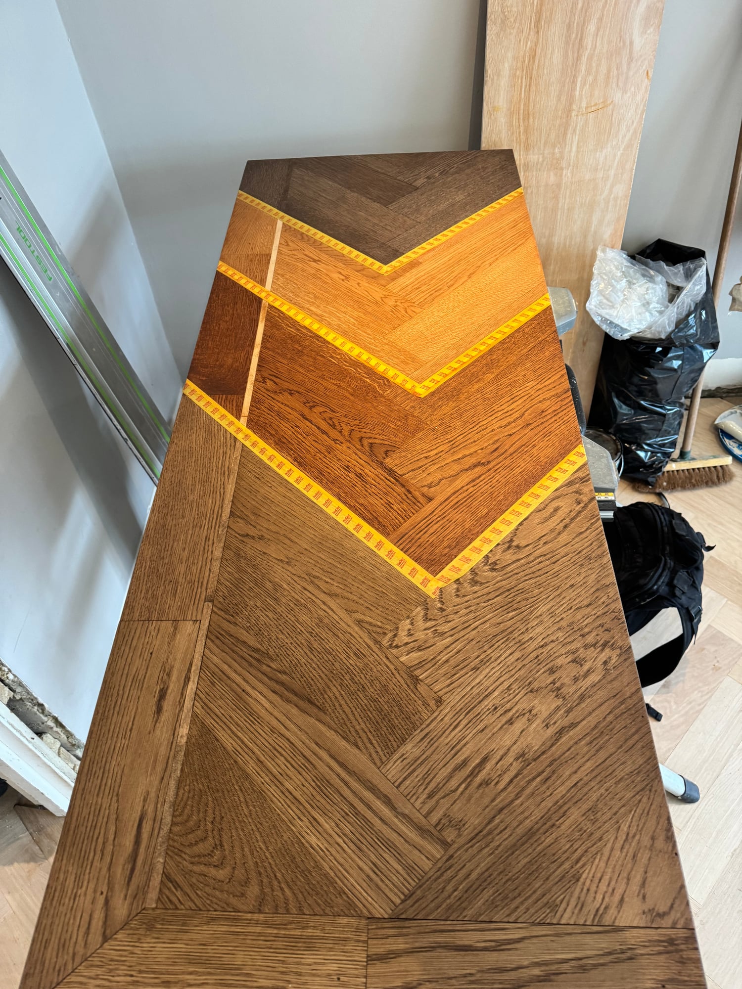 Dark stained herringbone parquet after colour change