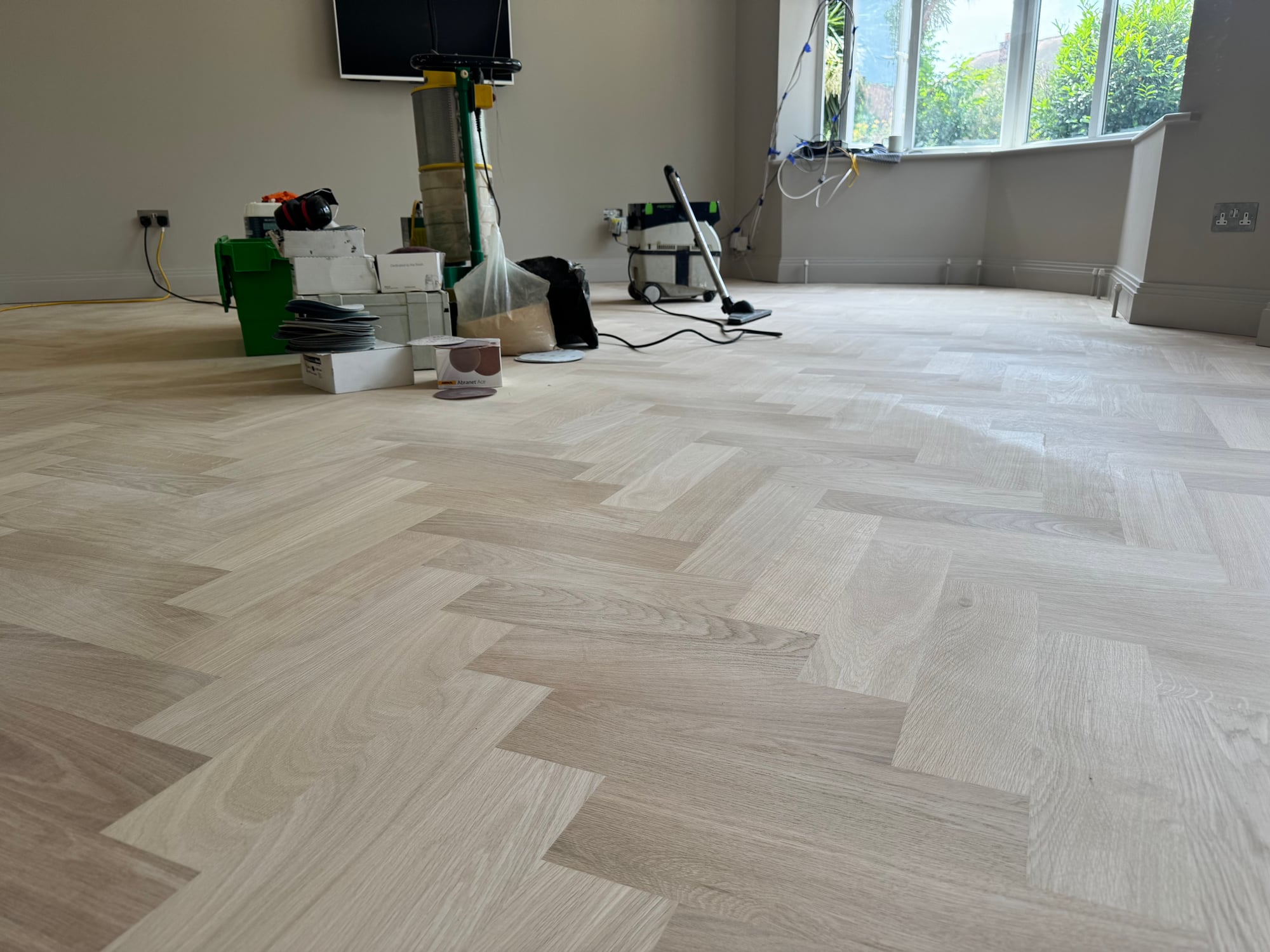 Light herringbone parquet in a living room